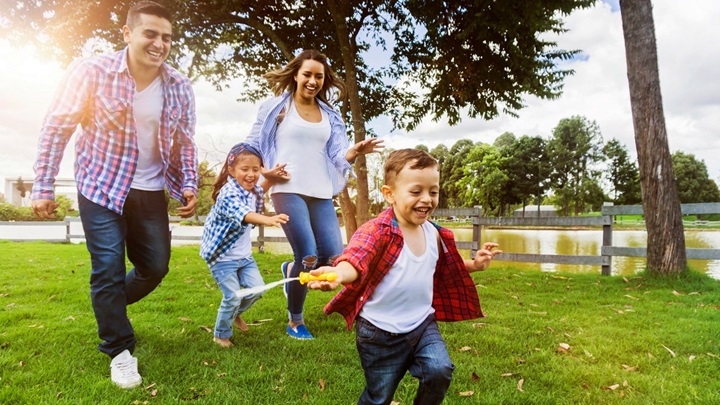 family playing in park